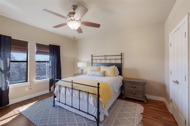 bedroom featuring ceiling fan and dark hardwood / wood-style flooring