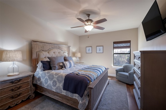 bedroom featuring ceiling fan and dark hardwood / wood-style flooring