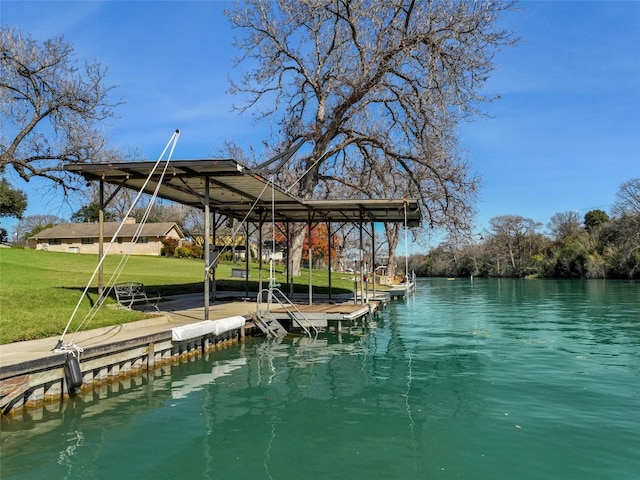 dock area featuring a water view and a yard