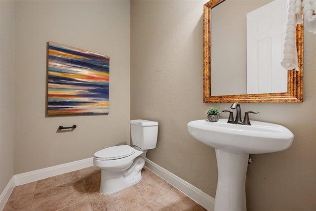 bathroom with tile patterned floors and toilet