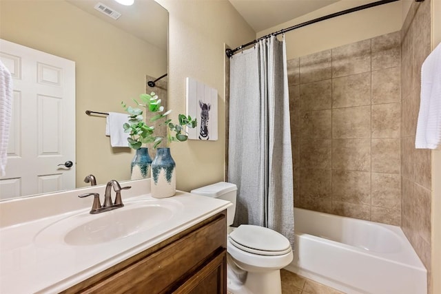 full bathroom with tile patterned floors, vanity, toilet, and shower / tub combo