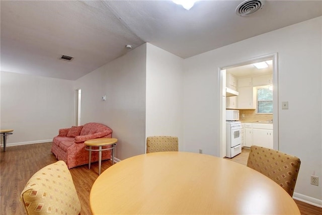 dining area featuring wood-type flooring