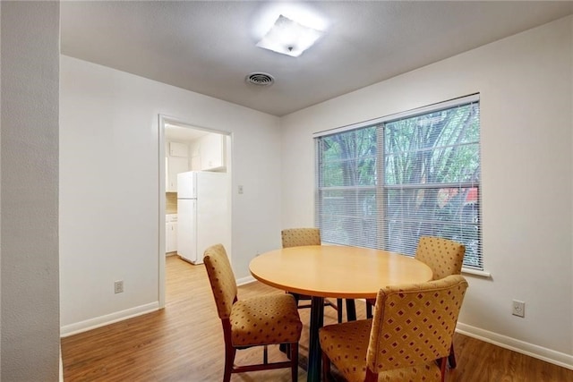 dining room with hardwood / wood-style floors