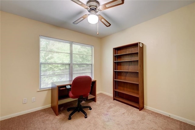 carpeted home office with ceiling fan