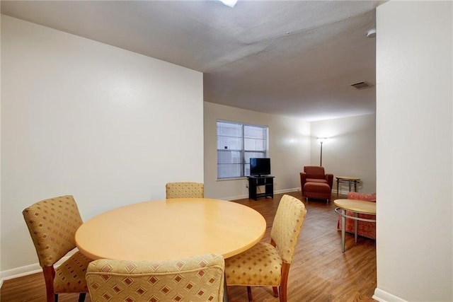 dining room with hardwood / wood-style floors