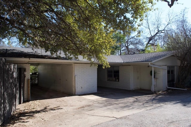 exterior space featuring a carport