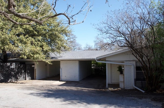 view of front of home featuring a carport