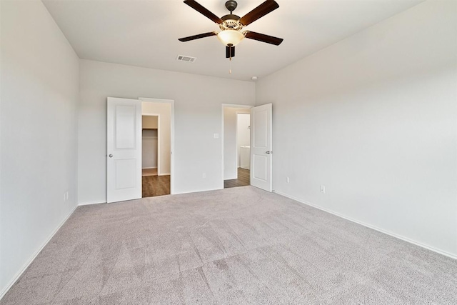 unfurnished bedroom with ceiling fan and carpet