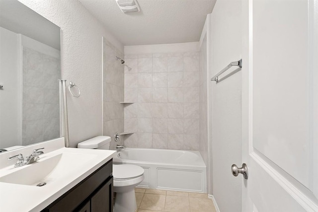 bathroom with tile patterned flooring, vanity, toilet, a textured ceiling, and  shower combination