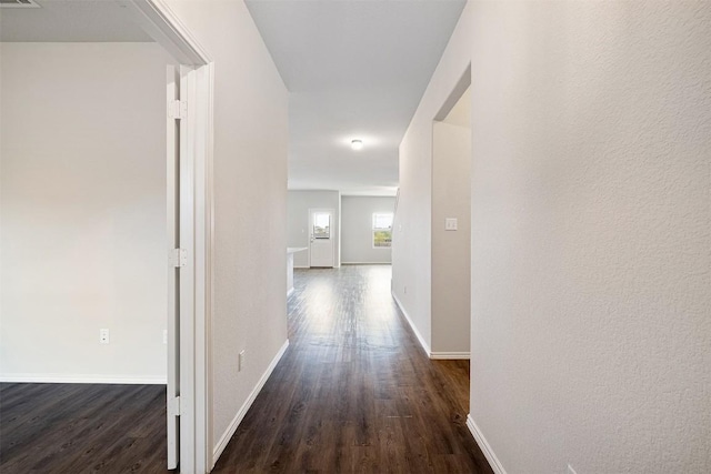 hall featuring dark wood-type flooring