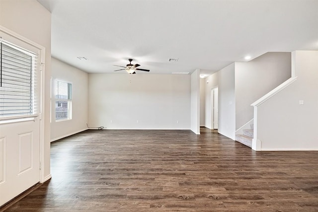 unfurnished living room with ceiling fan and dark hardwood / wood-style flooring