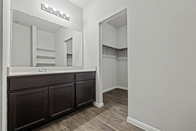 bathroom with vanity and hardwood / wood-style flooring