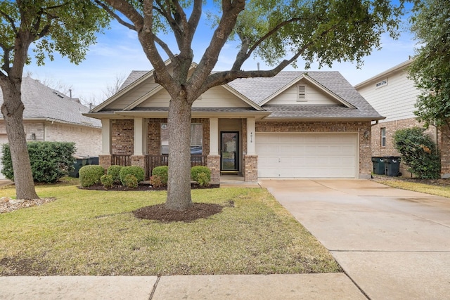 view of front facade featuring a garage, a porch, and a front yard