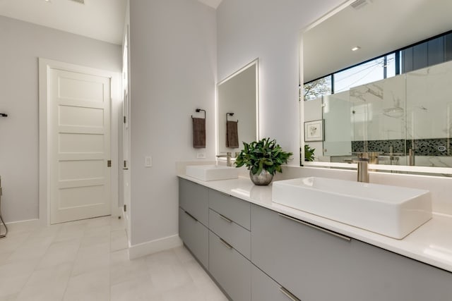 bathroom featuring vanity, tile patterned flooring, and a shower with door