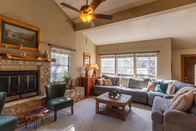 living room with ceiling fan, carpet flooring, a fireplace, a textured ceiling, and vaulted ceiling