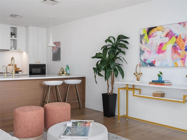 70 Rainey St Unit 1705, Austin, TX 78701 - dining room featuring wood finished floors and baseboards
