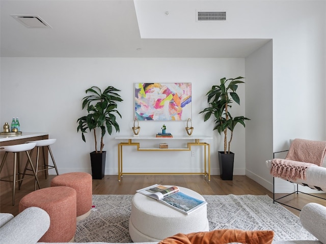 70 Rainey St Unit 1705, Austin, TX 78701 - living area featuring wood finished floors, baseboards, and a skylight