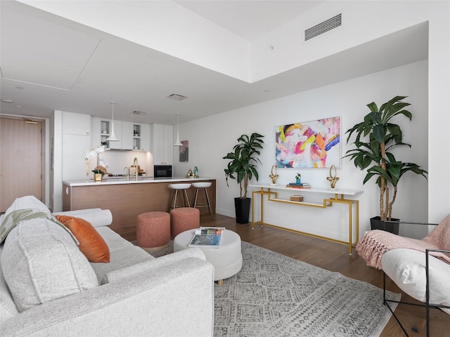 living room with dark hardwood / wood-style floors