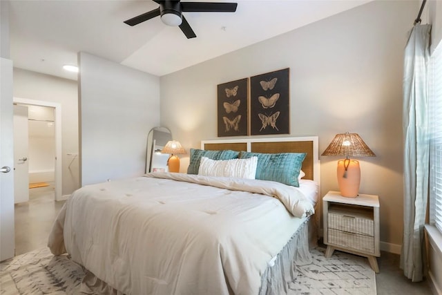 bedroom with ensuite bath and ceiling fan