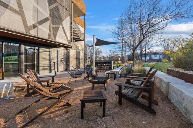 view of patio / terrace with an outdoor fire pit