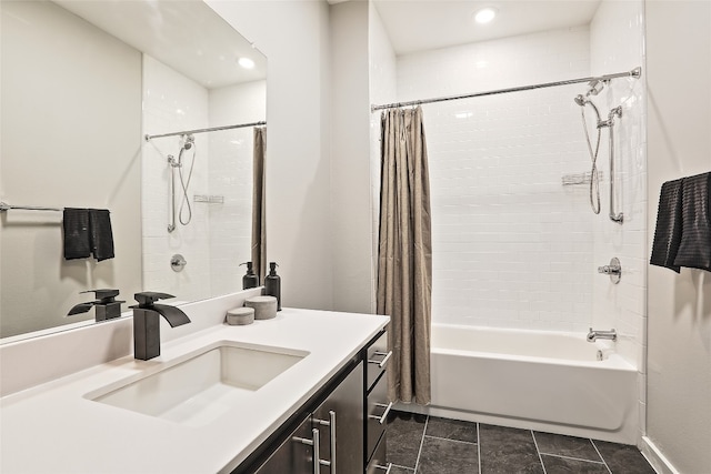 bathroom featuring shower / bath combo and vanity