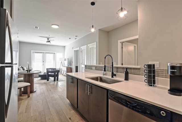 kitchen with french doors, light countertops, visible vents, appliances with stainless steel finishes, and a sink