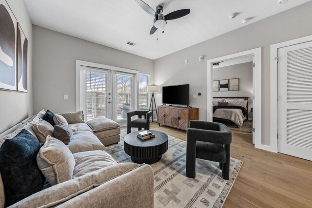 2505 Thornton Rd Unit 1110, Austin, TX 78704 - living area with french doors, light wood-style flooring, and a ceiling fan