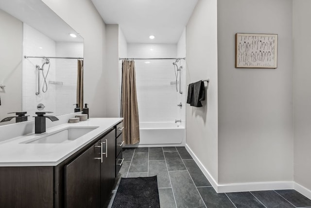 full bathroom with tile patterned floors, baseboards, shower / tub combo with curtain, and vanity