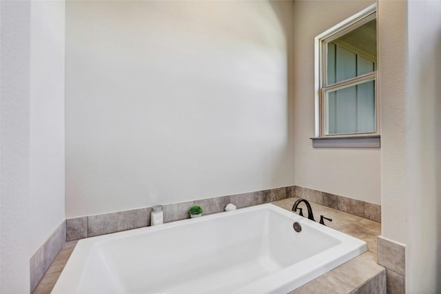 bathroom featuring tiled tub