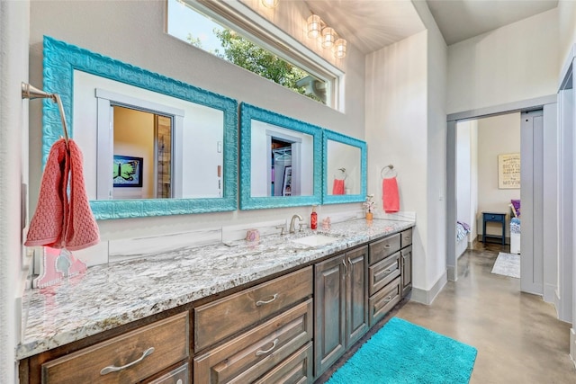 bathroom with vanity and concrete floors