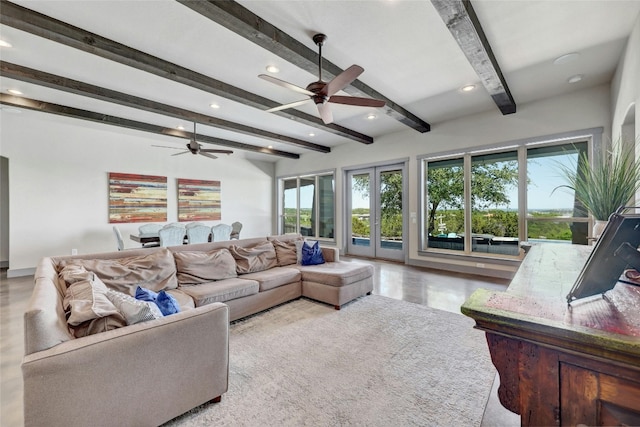 living room featuring beamed ceiling, ceiling fan, and french doors