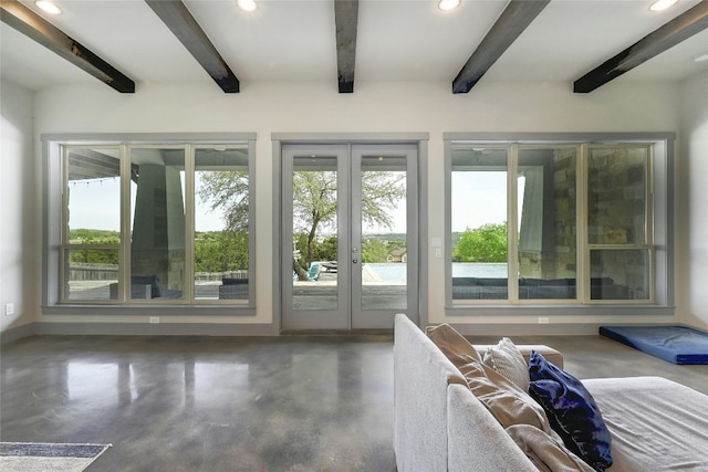 doorway with beamed ceiling and french doors