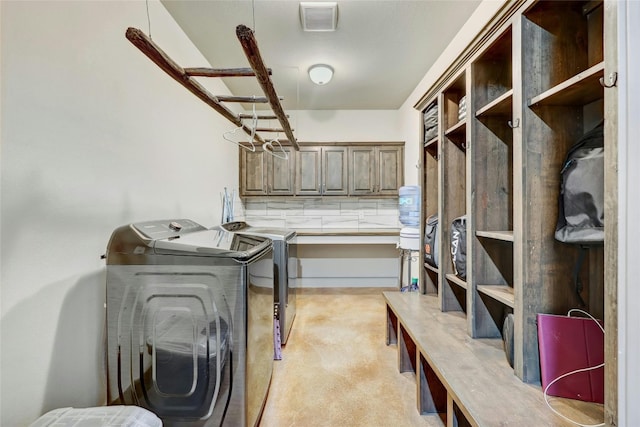 laundry area with light carpet and washer and clothes dryer