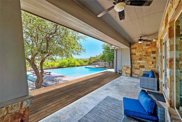 view of pool featuring ceiling fan