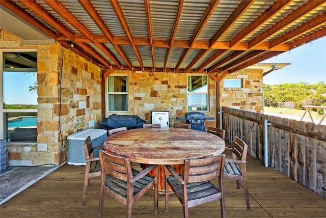 view of patio with area for grilling and a deck