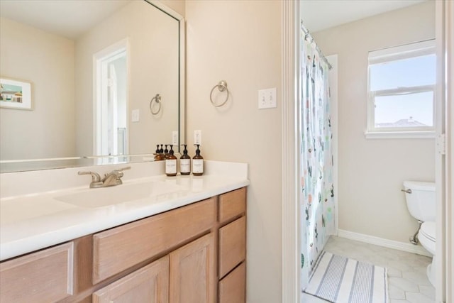 bathroom with walk in shower, vanity, and toilet