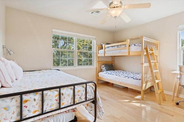 bedroom with hardwood / wood-style flooring and ceiling fan