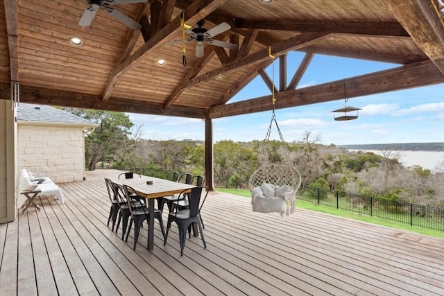 wooden terrace with a gazebo, ceiling fan, and a water view