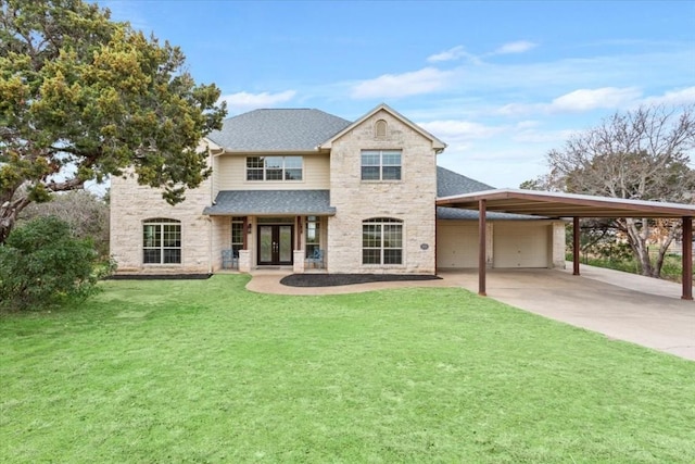 view of front facade with a garage and a front lawn