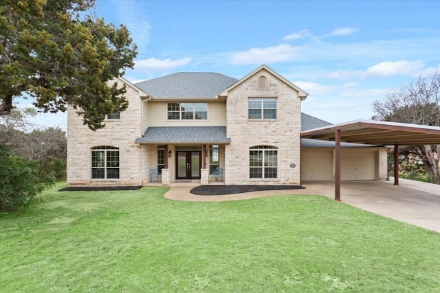 view of front of house with french doors, a carport, and a front yard