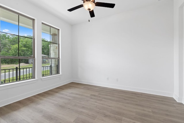 118 Bateleurfrey Cv, Cedar Creek, TX 78612 - unfurnished room featuring wood finished floors and a ceiling fan