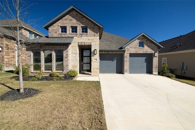 view of front facade with a garage and a front yard