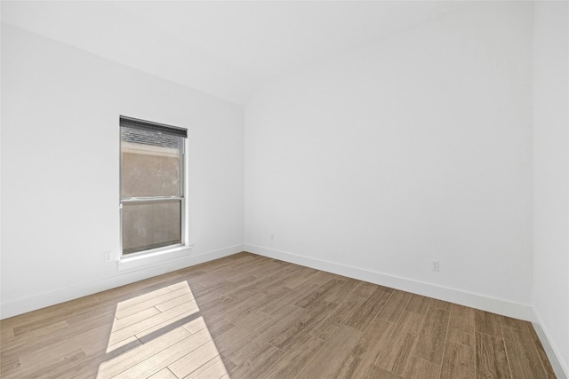 unfurnished room with light hardwood / wood-style floors