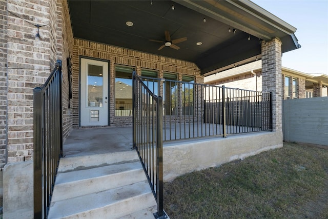 view of gate with ceiling fan