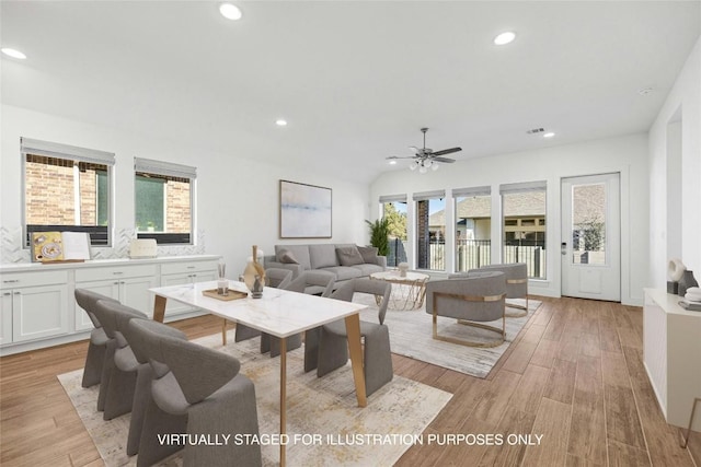 living room with ceiling fan and light wood-type flooring