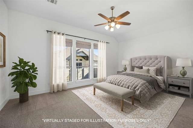 carpeted bedroom with vaulted ceiling and ceiling fan