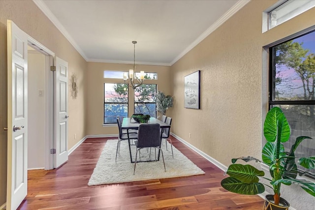 dining space featuring ornamental molding, dark hardwood / wood-style floors, and a notable chandelier