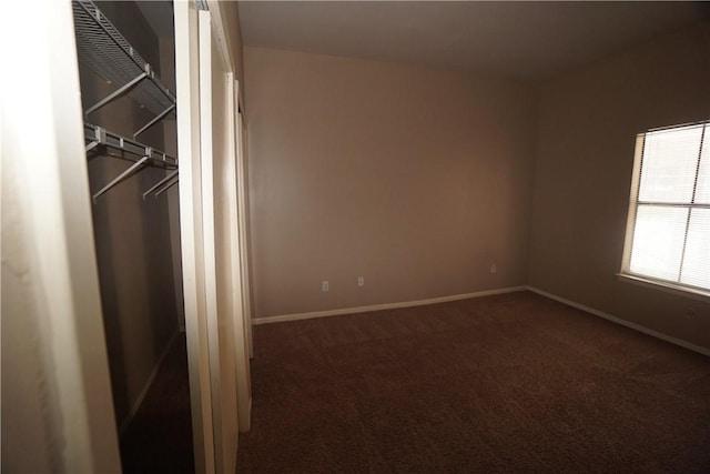 interior space with dark colored carpet