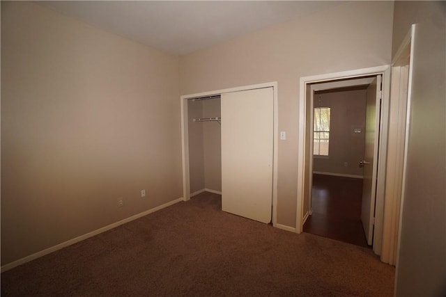 unfurnished bedroom with a closet and carpet