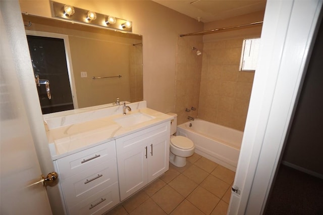 full bathroom featuring tiled shower / bath combo, vanity, tile patterned floors, and toilet